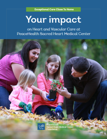 A smiling couple plants flowers outside with two young children.